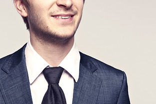 Young smiling guy in suit